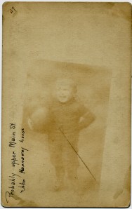 Ghost image of a little boy holding a ball
